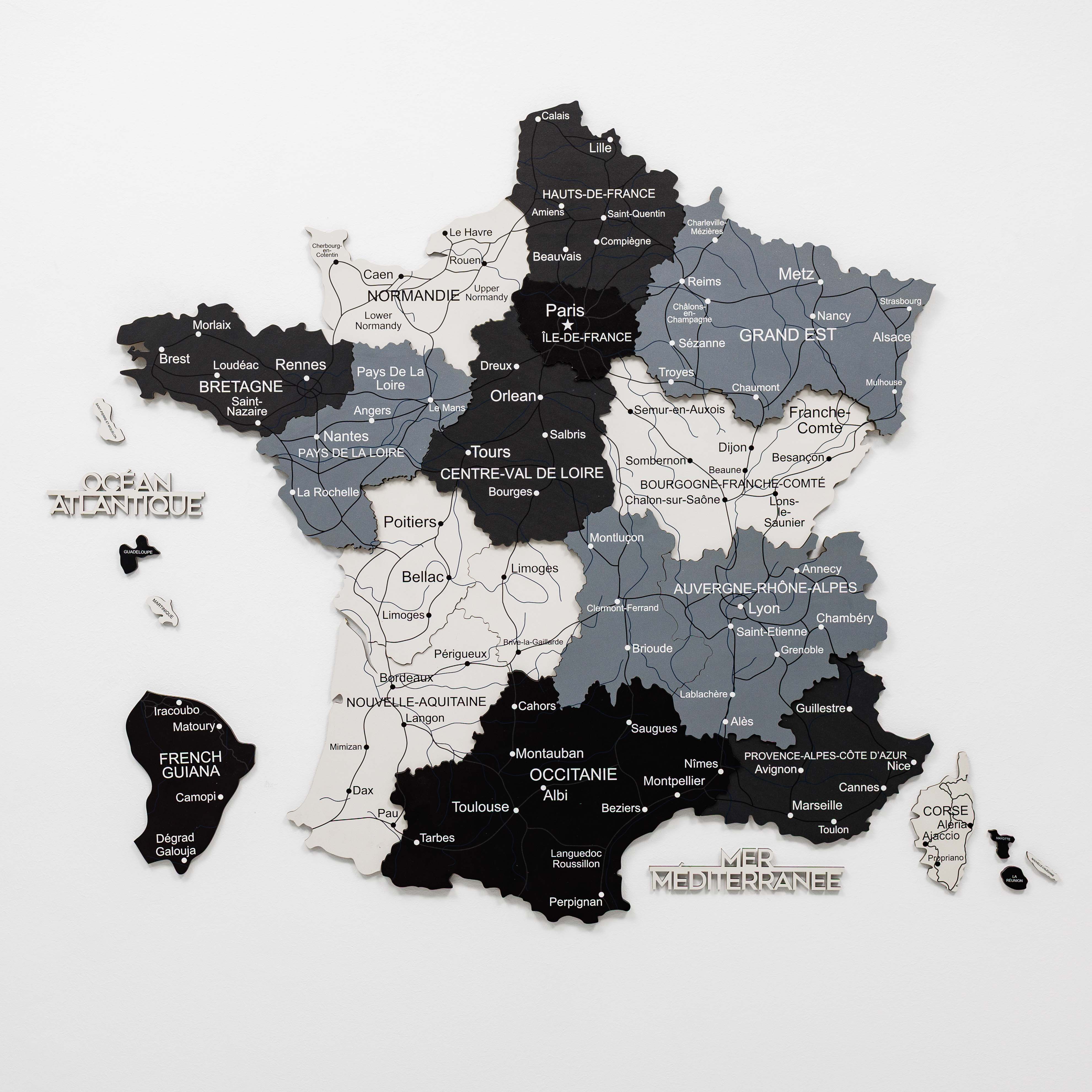 Woman interacting with a wall-mounted map of France
