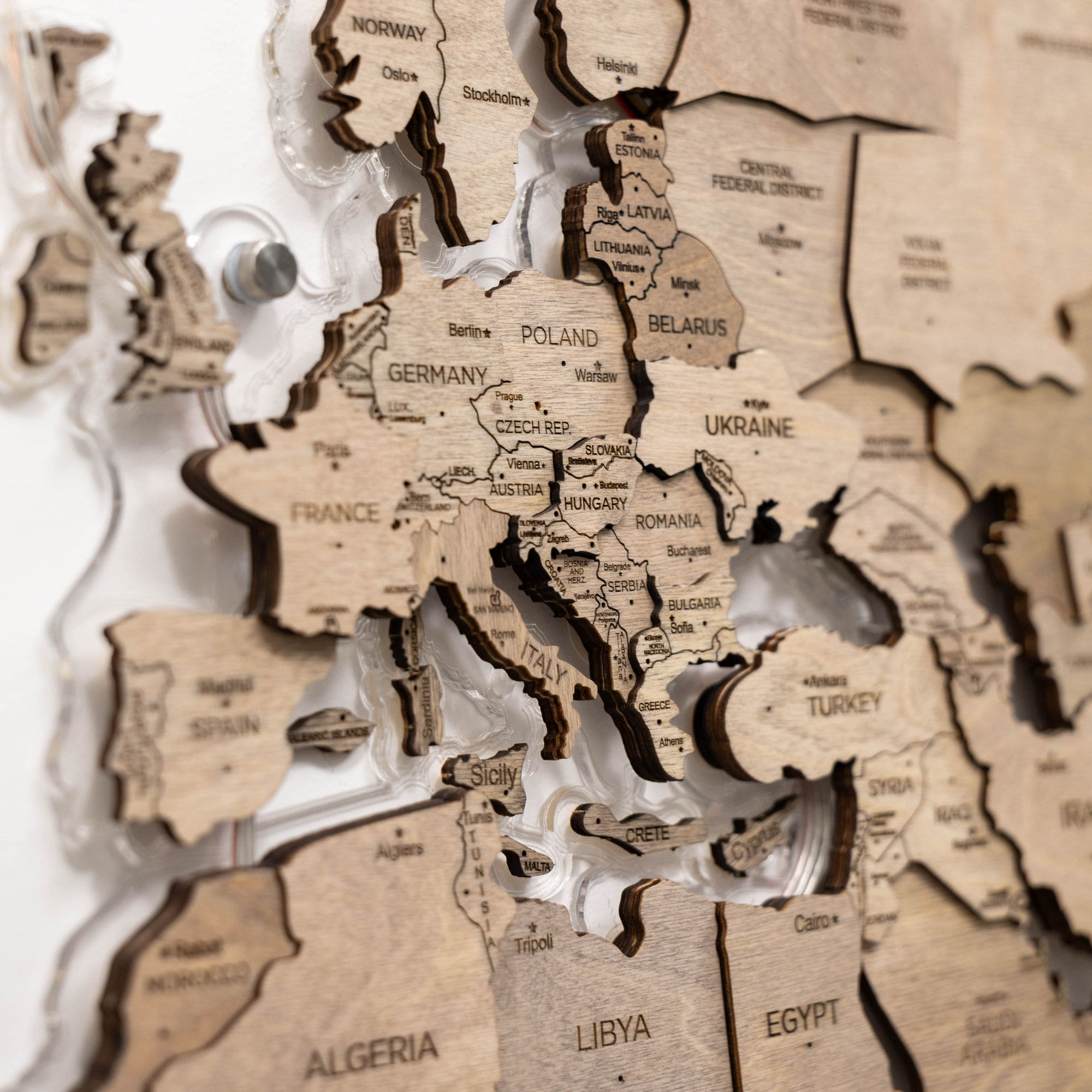 Wooden map of Europe with countries labeled on a white background