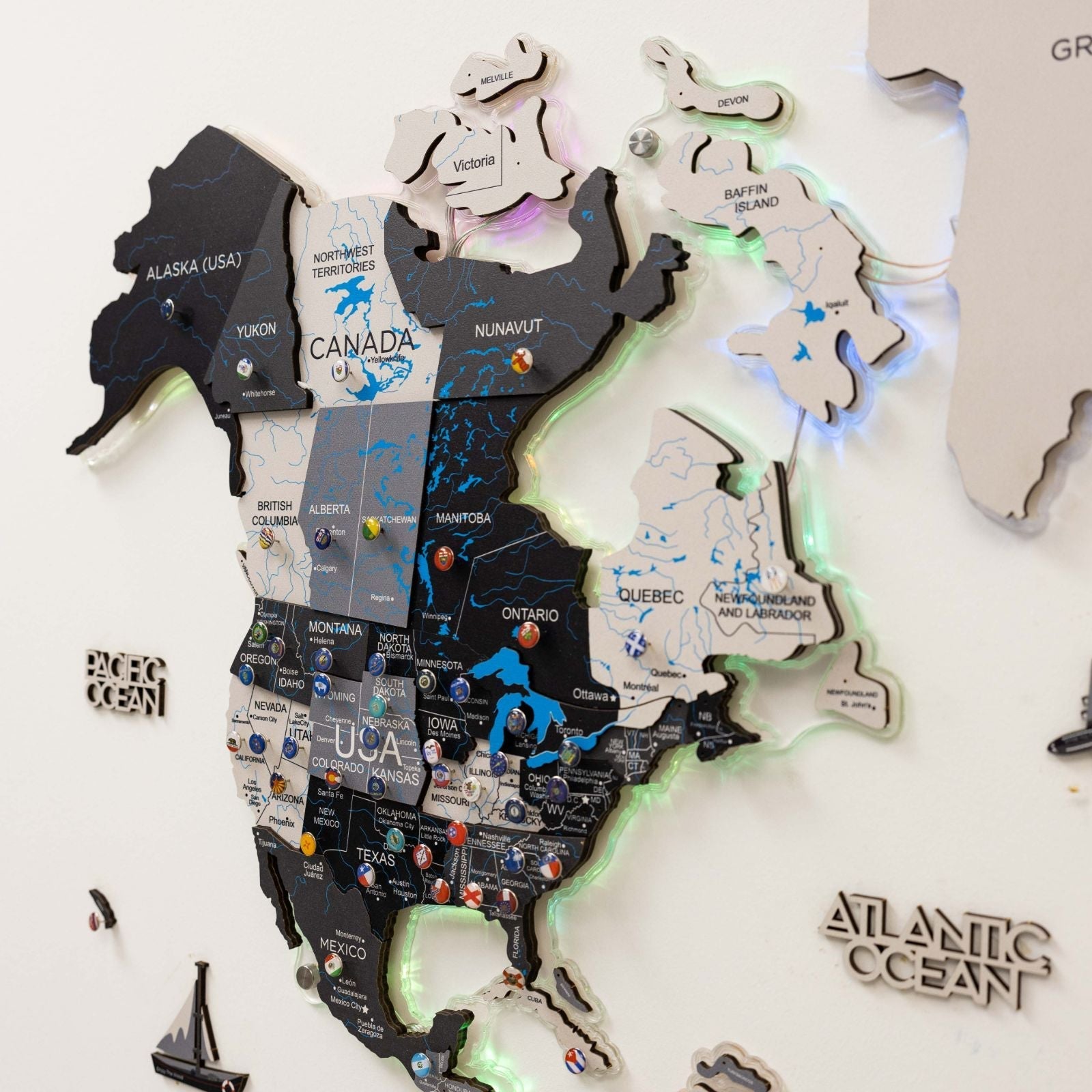 Wooden map of Canada with illuminated lights on a white background