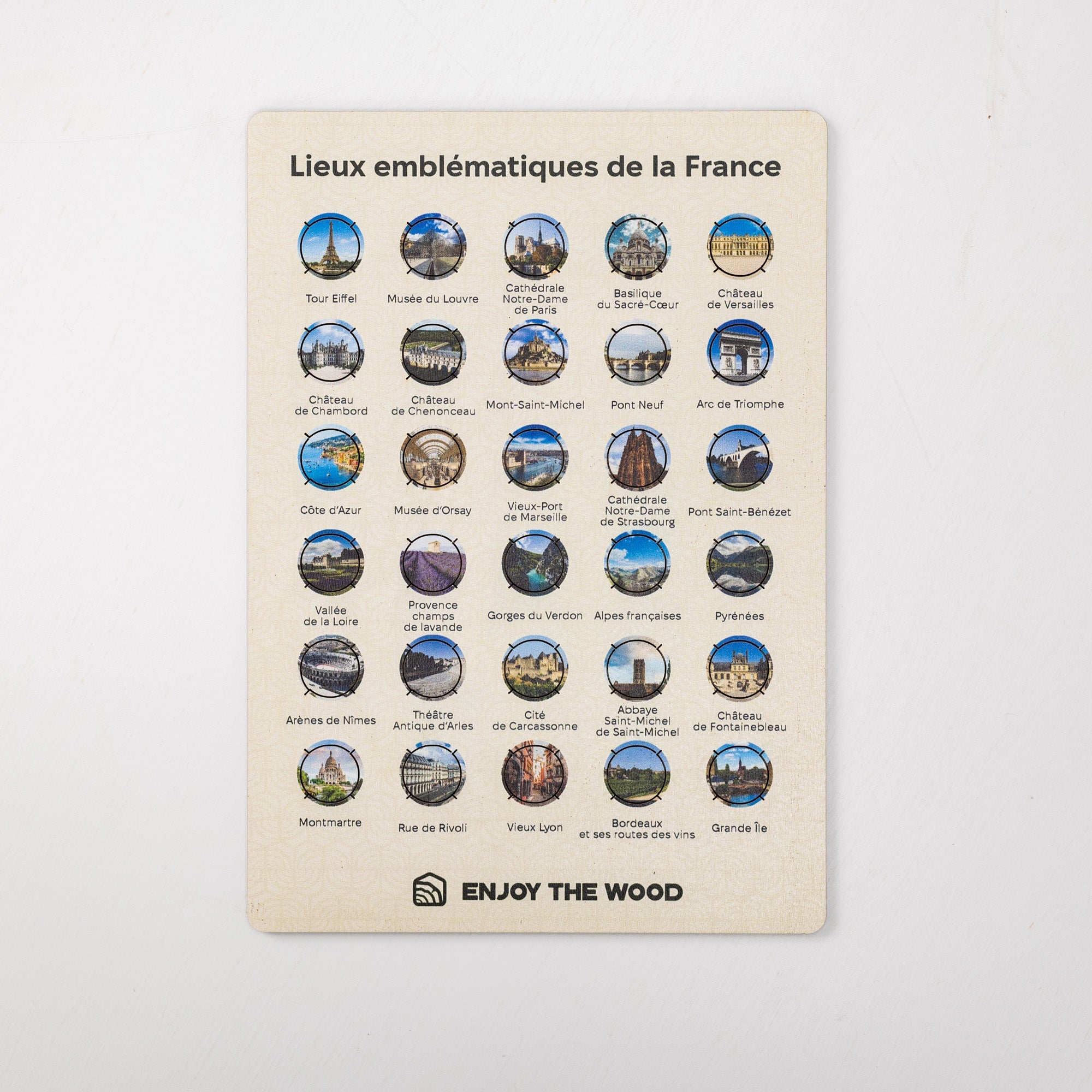 Poster with emblematic locations of France and 'Enjoy the Wood' branding on a light gray background