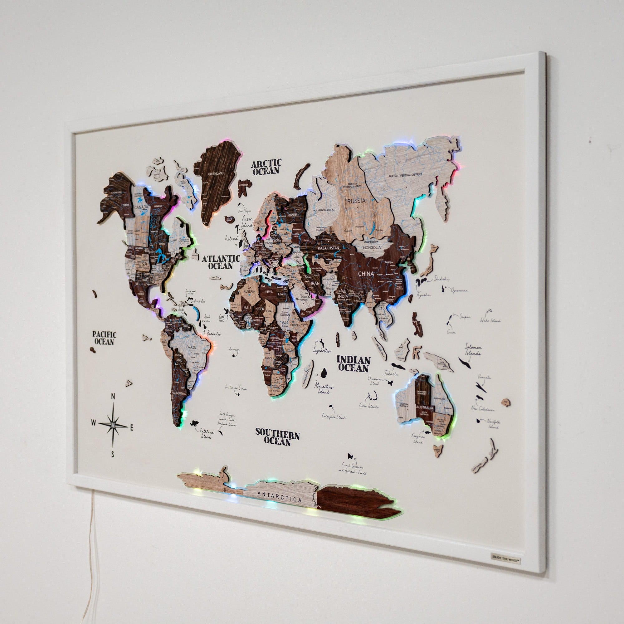 World map with LED lights on a white wall