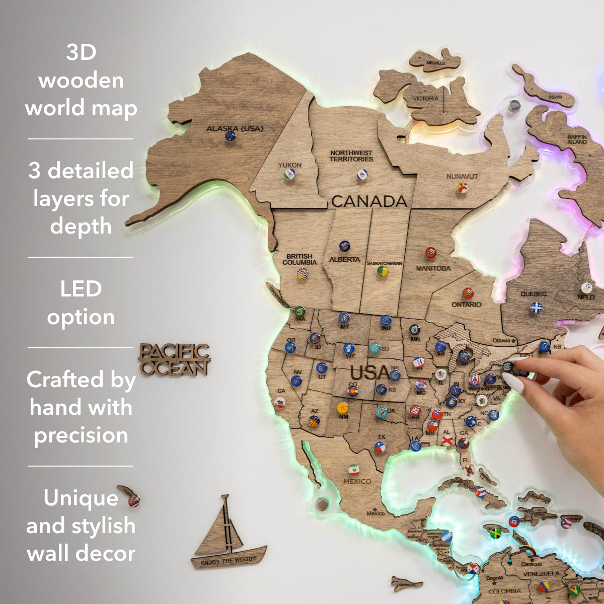 3D wooden world map with LED lighting, detailed layers, and hand interacting with it.