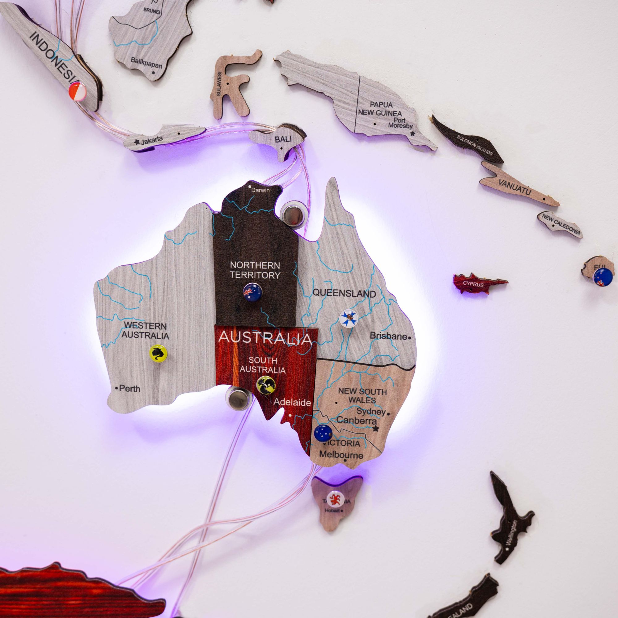 Wooden map of Australia with LED lights on a white background